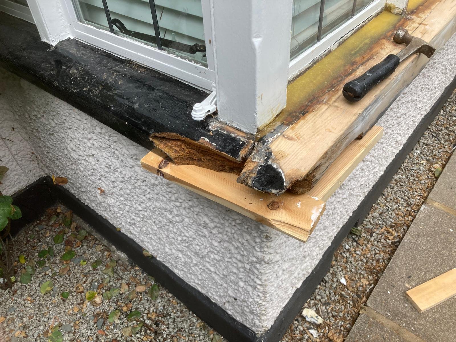 Rotten sill corner cut back and supported, ready for repair