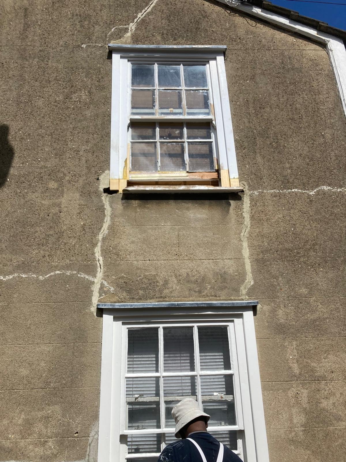 New timber spliced into the sill and frame of an upper sash window