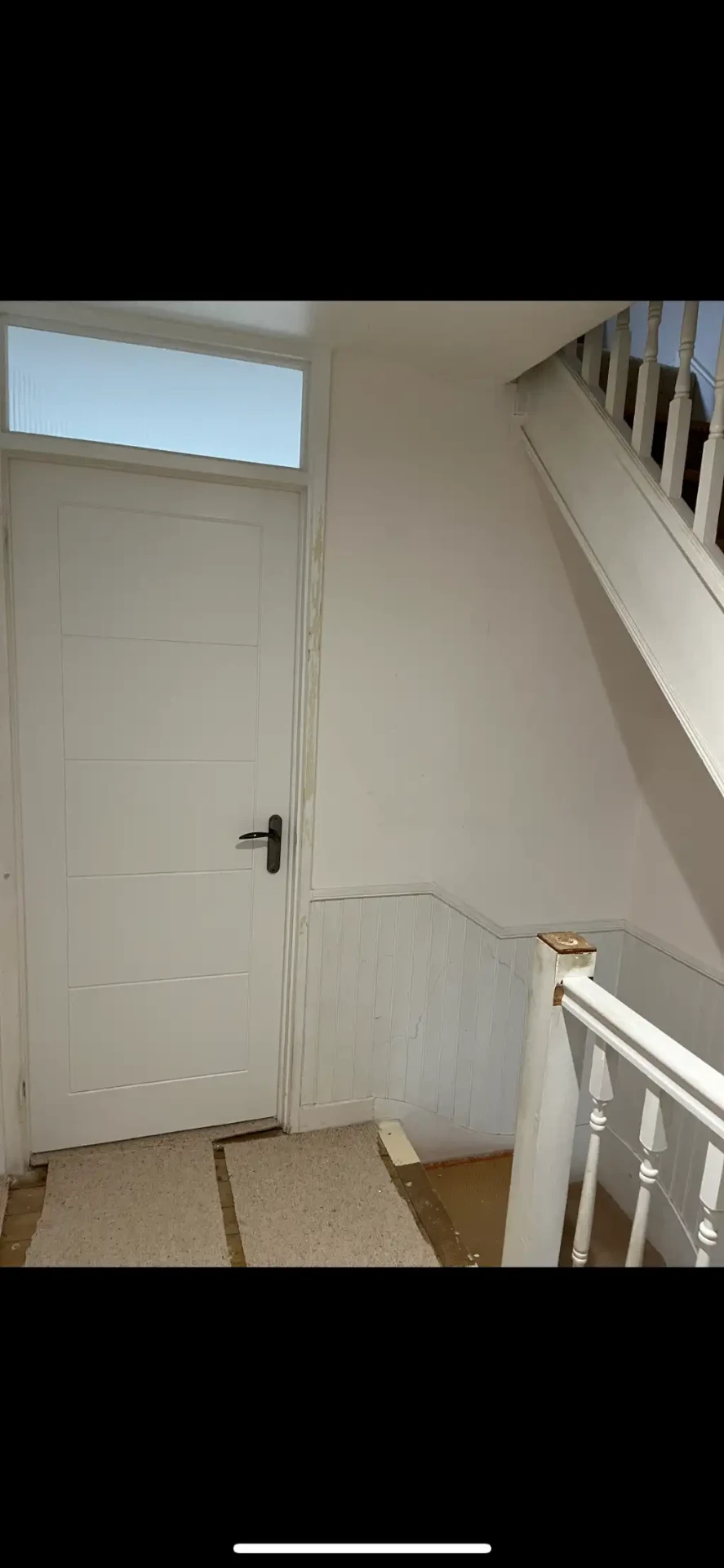 Bare hallway woodwork before panelling and painting in Strawberry Hill